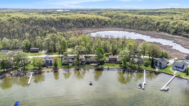 8570 Riverside Dr, Brighton, MI 48116 - aerial view of residential area with a forest and a nearby body of water