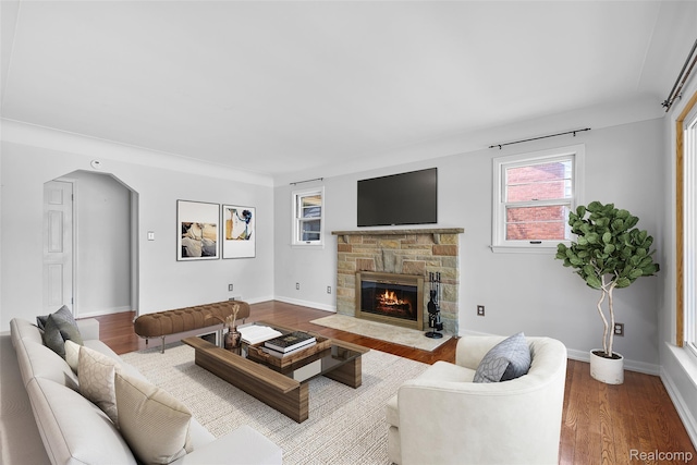 18470 Outer Dr, Dearborn, MI 48128 - living area featuring wood finished floors and a stone fireplace