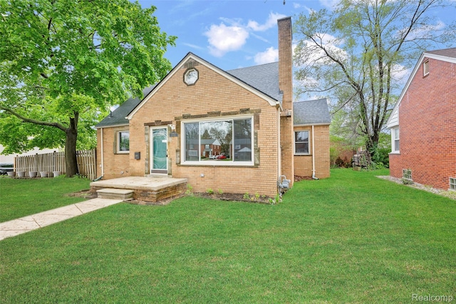 18470 Outer Dr, Dearborn, MI 48128 - bungalow-style home featuring brick siding, a chimney, and roof with shingles