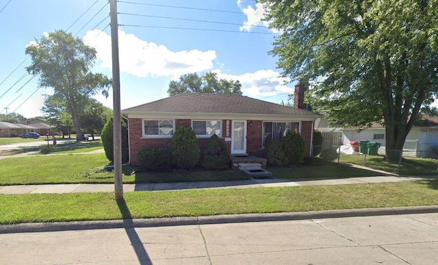19000 Rosetta Ave, Eastpointe, MI 48021 - bungalow-style home with a front yard, brick siding, and a chimney