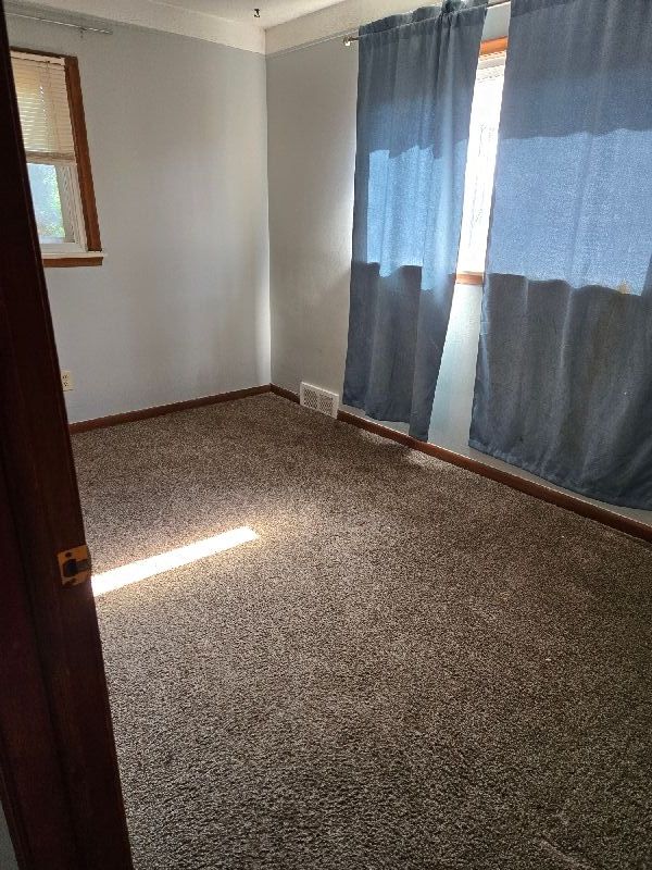 19000 Rosetta Ave, Eastpointe, MI 48021 - carpeted spare room with baseboards