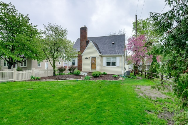 2847 N Custer Rd, Monroe, MI 48162 - back of house with a chimney, roof with shingles, and cooling unit