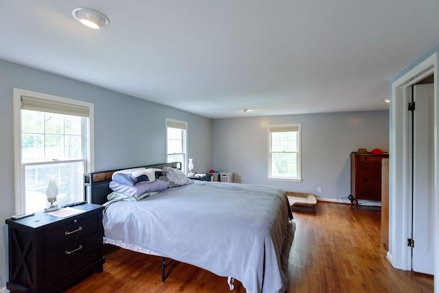 2847 N Custer Rd, Monroe, MI 48162 - bedroom featuring dark wood-style flooring and baseboards