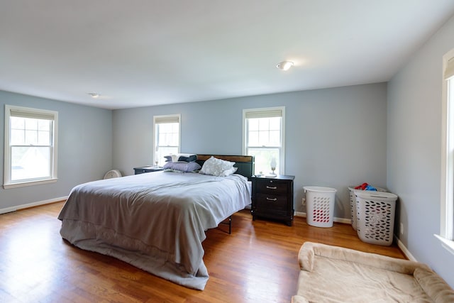 2847 N Custer Rd, Monroe, MI 48162 - bedroom with wood finished floors and baseboards
