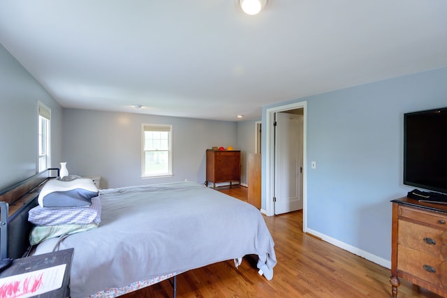 2847 N Custer Rd, Monroe, MI 48162 - bedroom with wood finished floors and baseboards