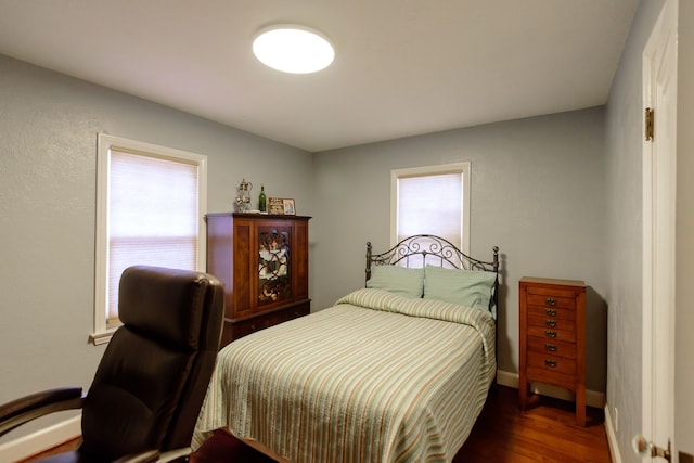 2847 N Custer Rd, Monroe, MI 48162 - bedroom featuring multiple windows, wood finished floors, and baseboards