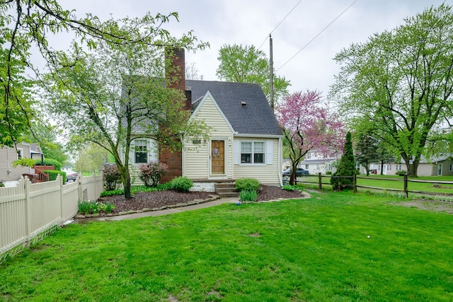 2847 N Custer Rd, Monroe, MI 48162 - view of front facade featuring a chimney and a shingled roof
