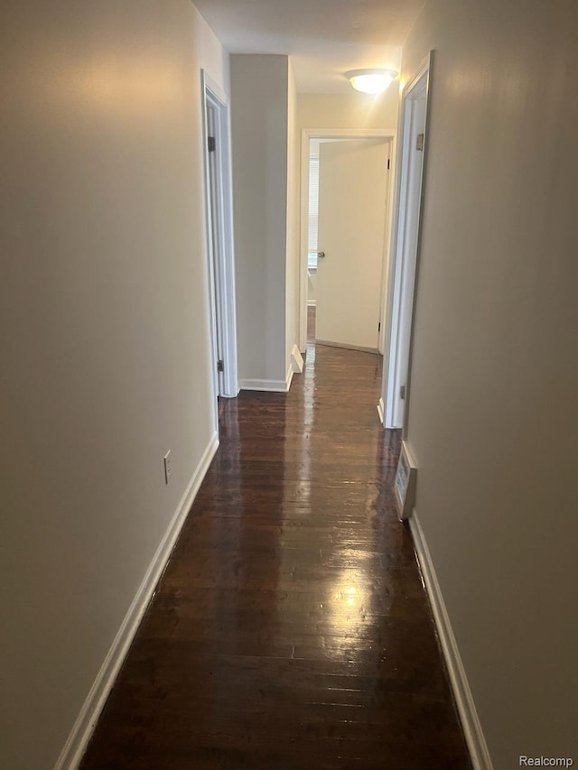 314 W 2nd Ave, Flint, MI 48503 - hall with dark wood finished floors and baseboards