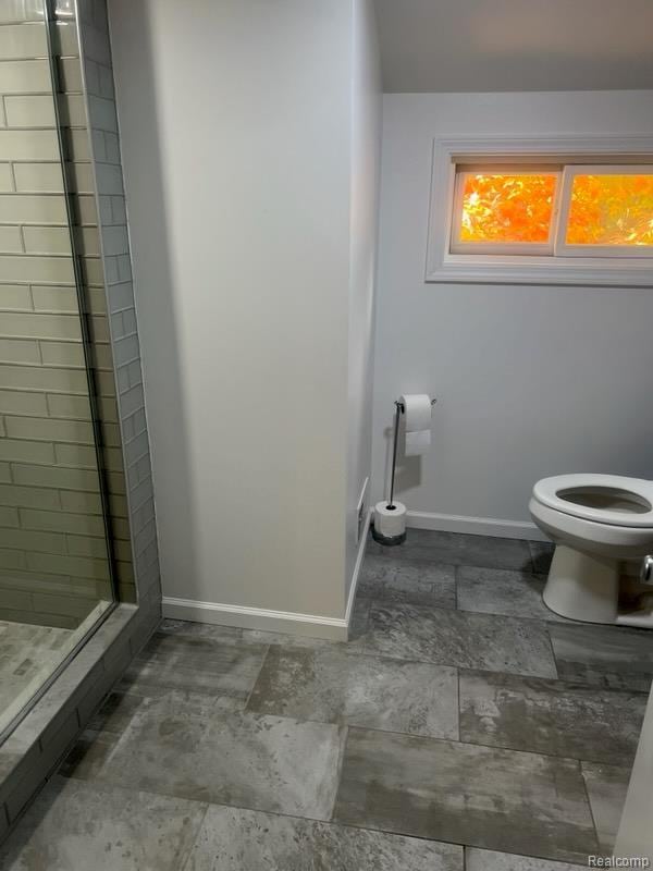 314 W 2nd Ave, Flint, MI 48503 - bathroom with toilet and a stall shower