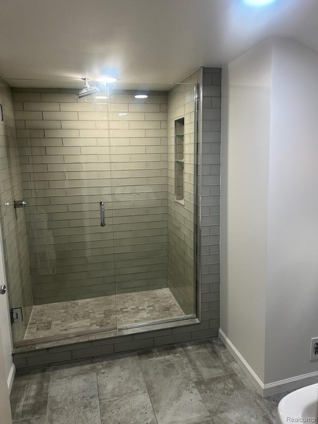314 W 2nd Ave, Flint, MI 48503 - bathroom with a shower stall and baseboards