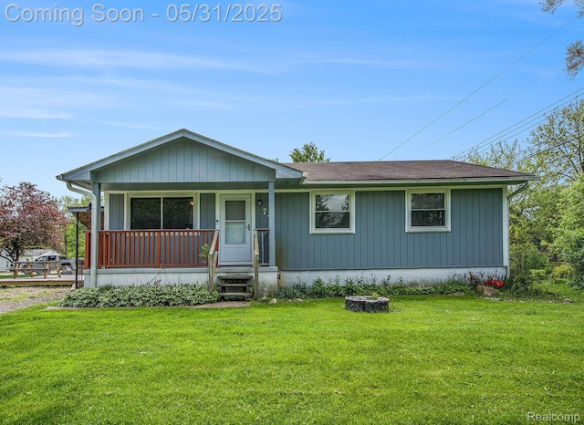 74 Ash Rd, Whitmore Lake, MI 48189 - view of front of home featuring a front yard and a porch