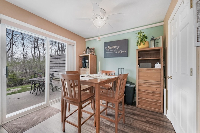 dining room with wood finished floors and ceiling fan