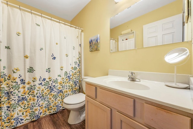 full bathroom with toilet, wood finished floors, vanity, and a shower with curtain
