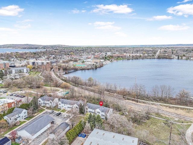 aerial view of residential area with a large body of water