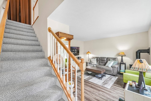 stairway with wood finished floors