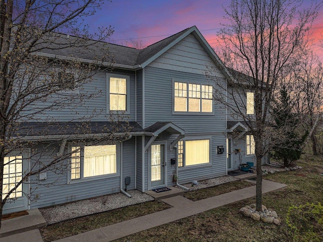 view of front of house featuring roof with shingles