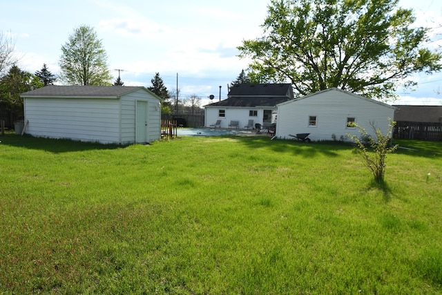56193 Murray St, Mattawan, MI 49071 - view of yard featuring a storage unit, a patio area, and an outdoor structure