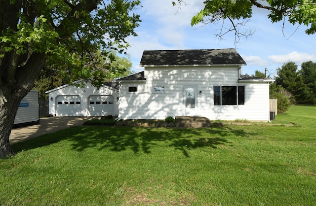 56193 Murray St, Mattawan, MI 49071 - view of front facade with a front yard, an outdoor structure, and an attached garage