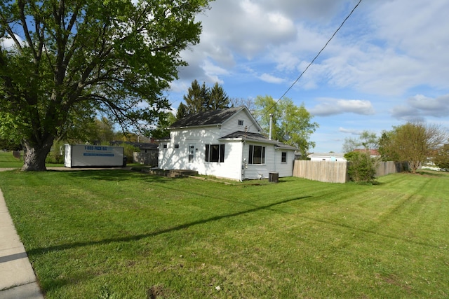 56193 Murray St, Mattawan, MI 49071 - rear view of property featuring cooling unit, fence, and a lawn