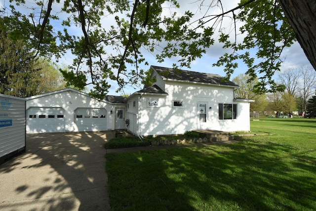 56193 Murray St, Mattawan, MI 49071 - view of front of house featuring concrete driveway, a garage, and a front lawn