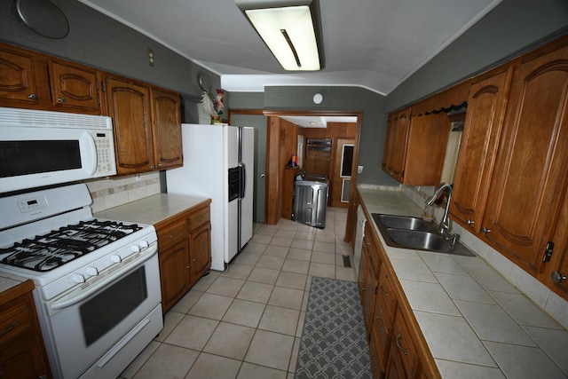 56193 Murray St, Mattawan, MI 49071 - kitchen featuring brown cabinets, white appliances, tile countertops, and a sink