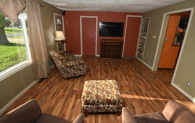 56193 Murray St, Mattawan, MI 49071 - living room featuring a textured ceiling, wood finished floors, and baseboards