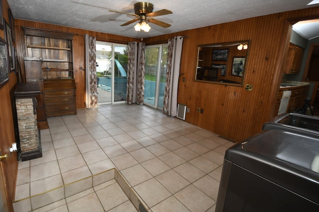56193 Murray St, Mattawan, MI 49071 - dining space with wooden walls, a ceiling fan, and light tile patterned floors