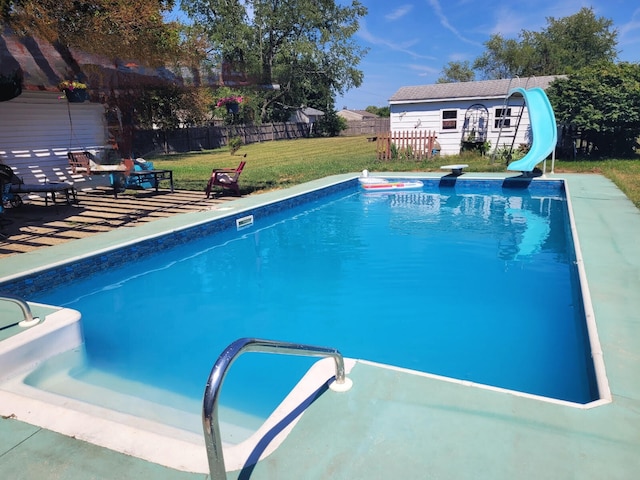 56193 Murray St, Mattawan, MI 49071 - view of swimming pool featuring a water slide, an outbuilding, and a diving board