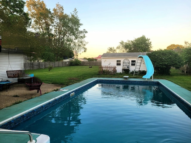56193 Murray St, Mattawan, MI 49071 - pool at dusk with a water slide and an outdoor structure