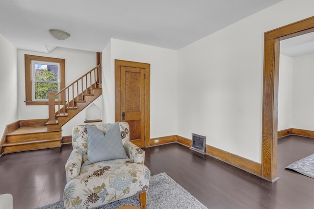 1212 Forest Ave, Jackson, MI 49201 - living room with baseboards, stairway, visible vents, and dark wood-type flooring