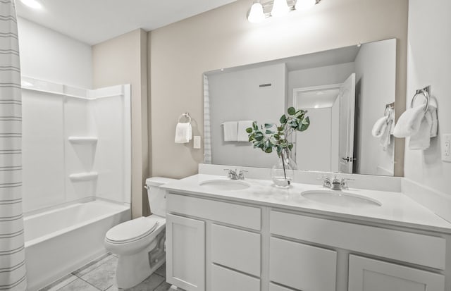 full bathroom featuring toilet, shower / bath combination with curtain, double vanity, and a sink