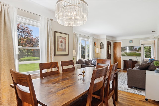 11389 Gold Arbor Rd, Plymouth, MI 48170 - dining space featuring wood finished floors and a chandelier