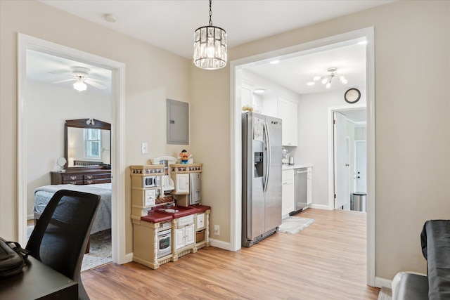 11389 Gold Arbor Rd, Plymouth, MI 48170 - office area featuring a chandelier, electric panel, light wood finished floors, baseboards, and ceiling fan