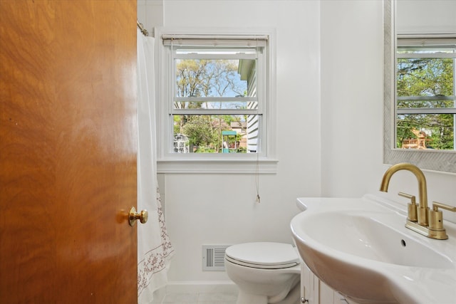 11389 Gold Arbor Rd, Plymouth, MI 48170 - bathroom with a sink, toilet, and a shower with shower curtain