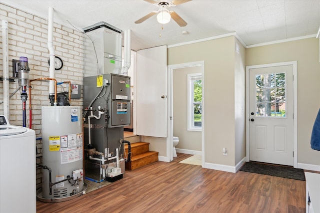 11389 Gold Arbor Rd, Plymouth, MI 48170 - entryway with gas water heater, washer / clothes dryer, wood finished floors, ceiling fan, and baseboards