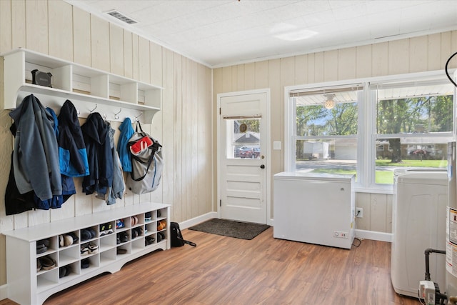 11389 Gold Arbor Rd, Plymouth, MI 48170 - mudroom with wood walls, wood finished floors, baseboards, washer / dryer, and crown molding