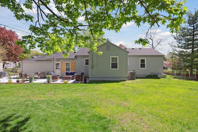 11389 Gold Arbor Rd, Plymouth, MI 48170 - back of property with central air condition unit, a patio area, an outdoor hangout area, and a shingled roof