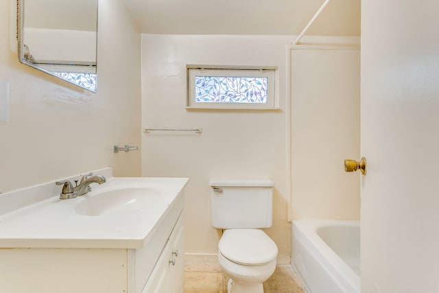 full bath with toilet, vanity, and baseboards