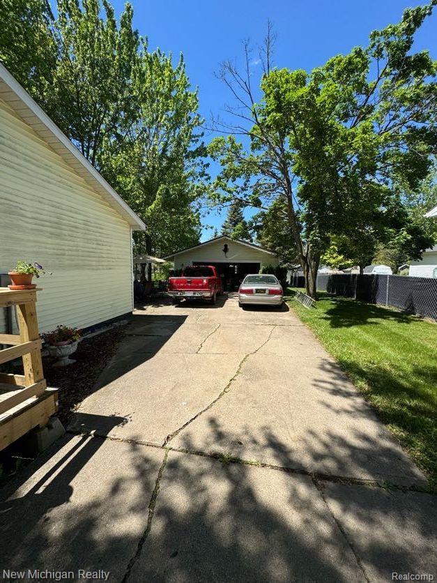 212 Sunnybrooke Dr, Vernon, MI 48476 - view of home's exterior with driveway