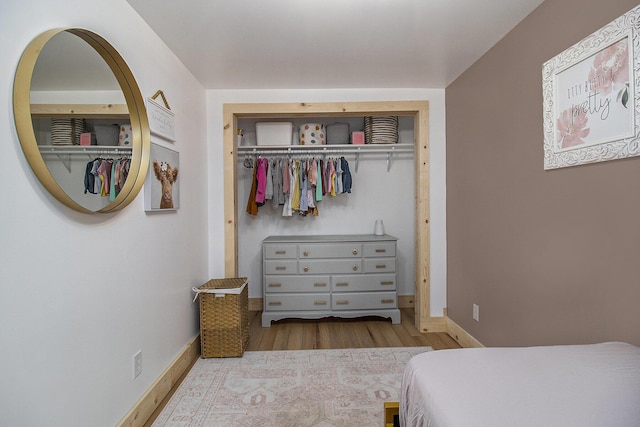 315 E Main St, Hart, MI 49420 - bedroom with a closet, wood finished floors, and baseboards