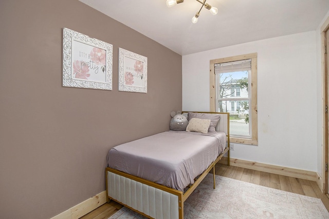315 E Main St, Hart, MI 49420 - bedroom featuring baseboards and wood finished floors