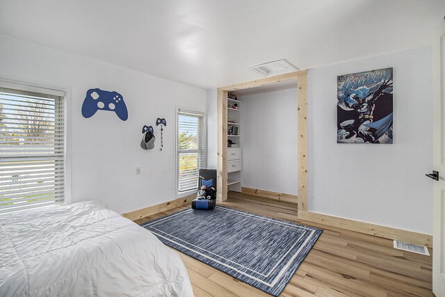 315 E Main St, Hart, MI 49420 - bedroom featuring visible vents and wood finished floors