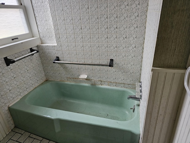 bathroom featuring a washtub