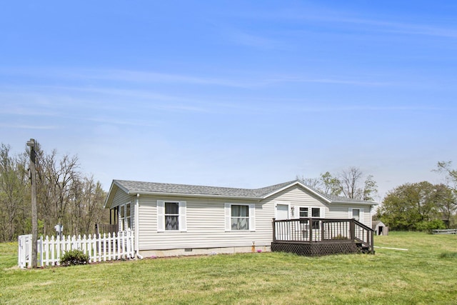 view of front of property featuring fence, crawl space, a front yard, a wooden deck, and a shingled roof
