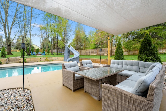 5849 Gavin Ln, Kalamazoo, MI 49009 - exterior space with an outdoor living space, a fenced in pool, a patio area, a water slide, and a fenced backyard