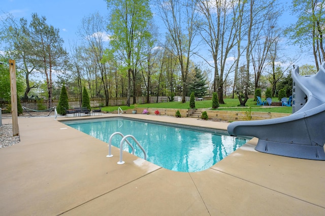 5849 Gavin Ln, Kalamazoo, MI 49009 - view of pool featuring a patio, fence, a water slide, a yard, and a fenced in pool
