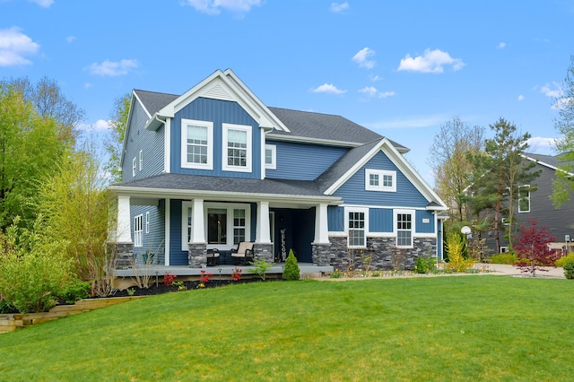 5849 Gavin Ln, Kalamazoo, MI 49009 - view of front facade featuring a porch, a front lawn, stone siding, and board and batten siding