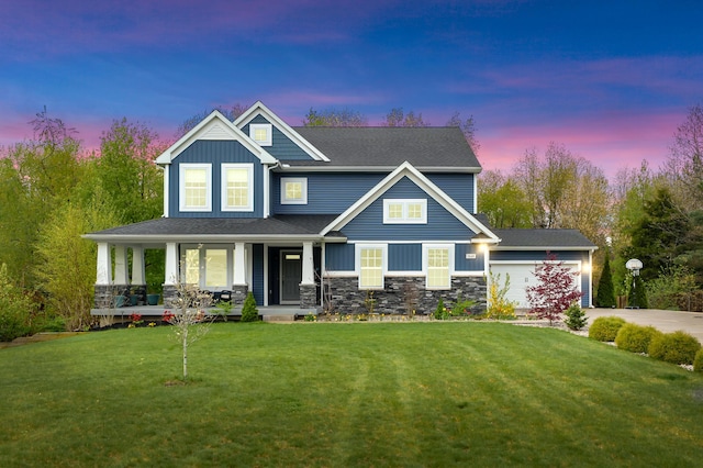 5849 Gavin Ln, Kalamazoo, MI 49009 - craftsman inspired home with a porch, board and batten siding, an attached garage, driveway, and a lawn