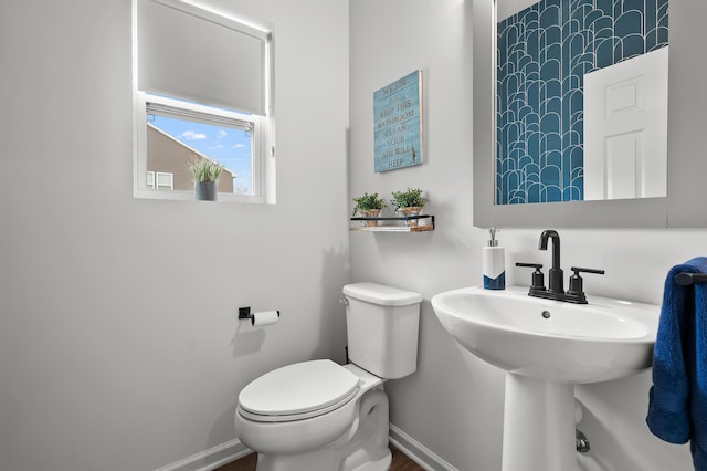 5849 Gavin Ln, Kalamazoo, MI 49009 - half bathroom featuring baseboards and toilet