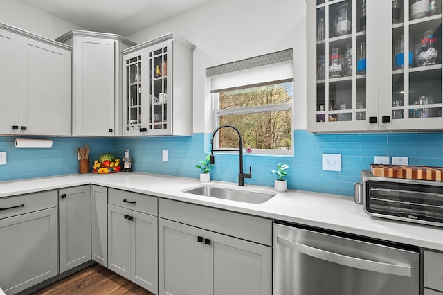 5849 Gavin Ln, Kalamazoo, MI 49009 - kitchen featuring light countertops, a sink, and stainless steel dishwasher